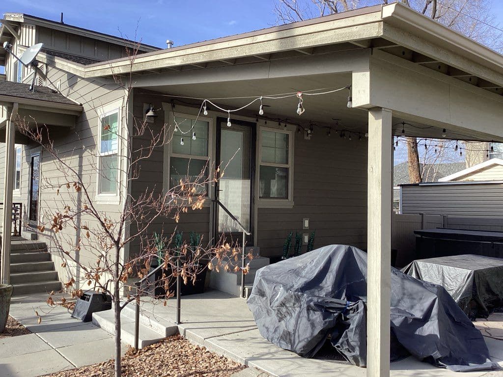 Patio Awning Installation with Concrete Floor and Ambient Lighting image